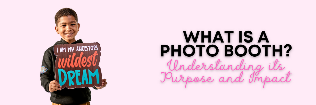 Small boy holding photo booth prop