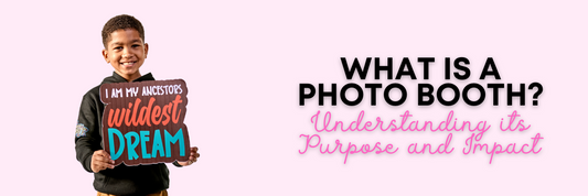 Small boy holding photo booth prop