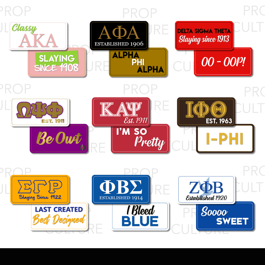 Collection of colorful prop signs with various text and logos on a white background