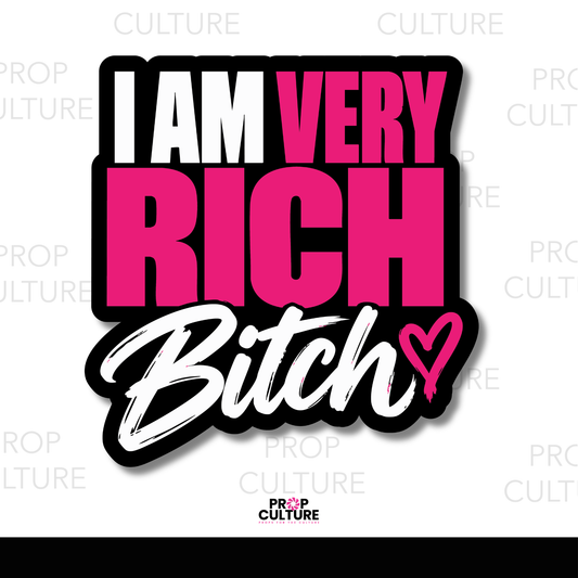 I Am Very Rich, Bitch photo booth word prop featuring bold white and hot pink block lettering, white script typography, and a pink heart on a black background.